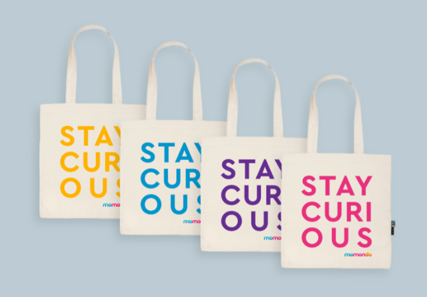 Four designed Stay Curious tote bag colourways, two of which were selected for production